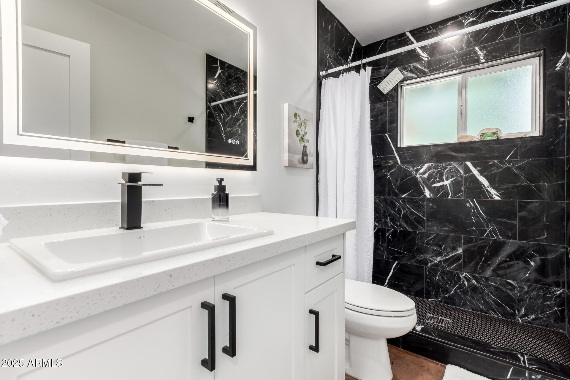4735 North 24th Street Phoenix, AZ 85016 - Photo 23 of 44 a bathroom with a sink a toilet and shower