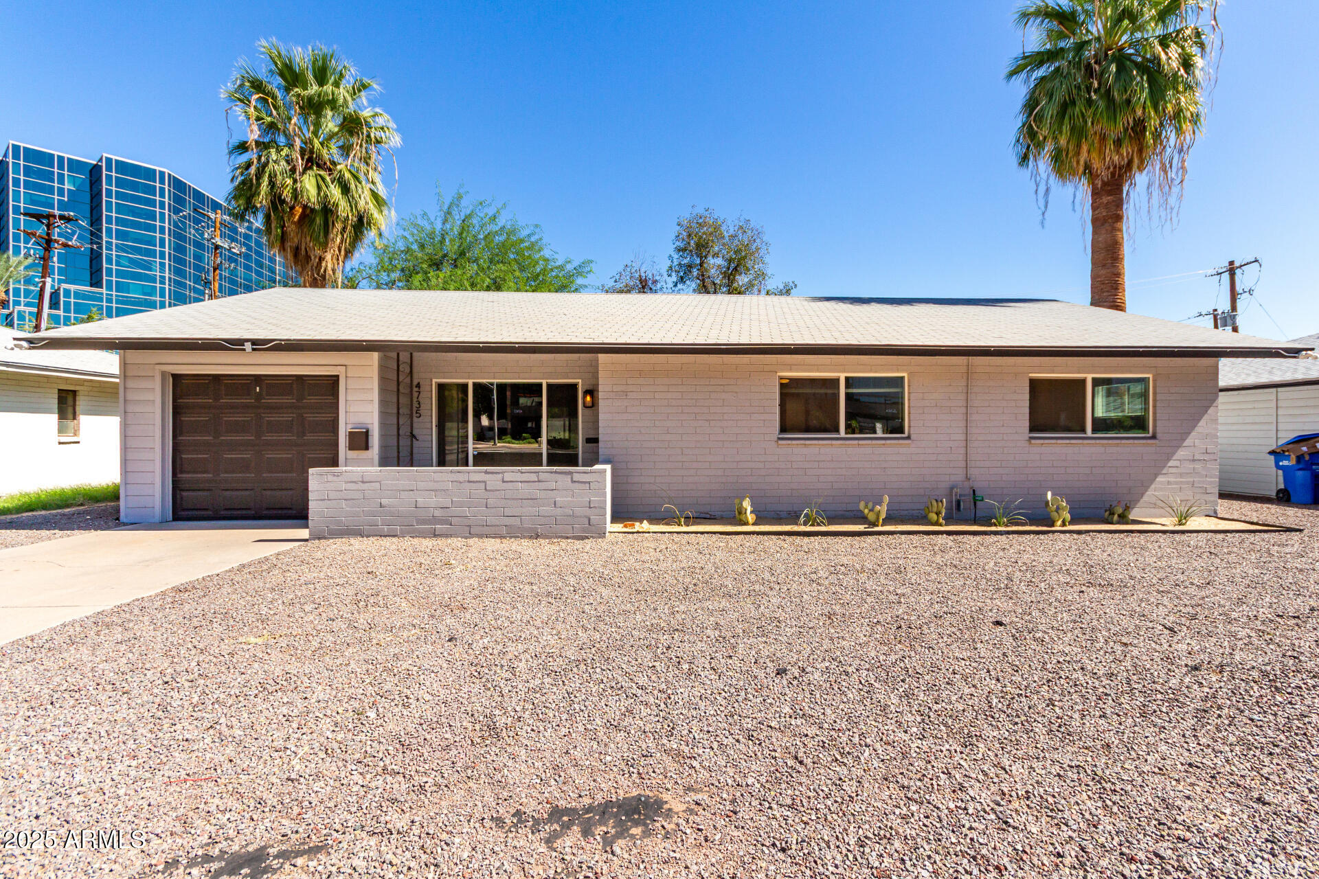 4735 North 24th Street Phoenix, AZ 85016 - Photo 2 of 44 a front view of a house with a yard and garage