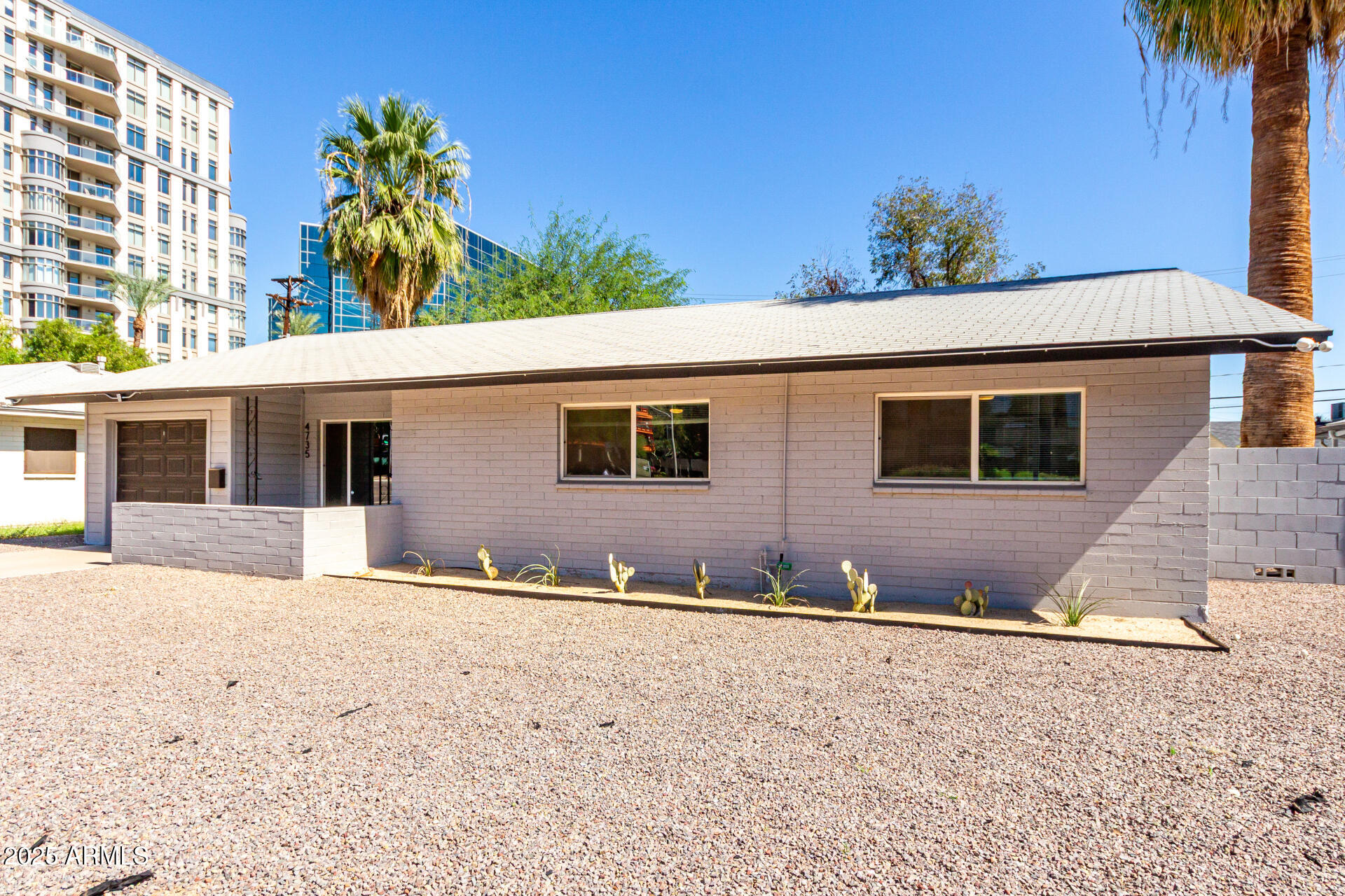 4735 North 24th Street Phoenix, AZ 85016 - Photo 3 of 44 a front view of a house with a yard