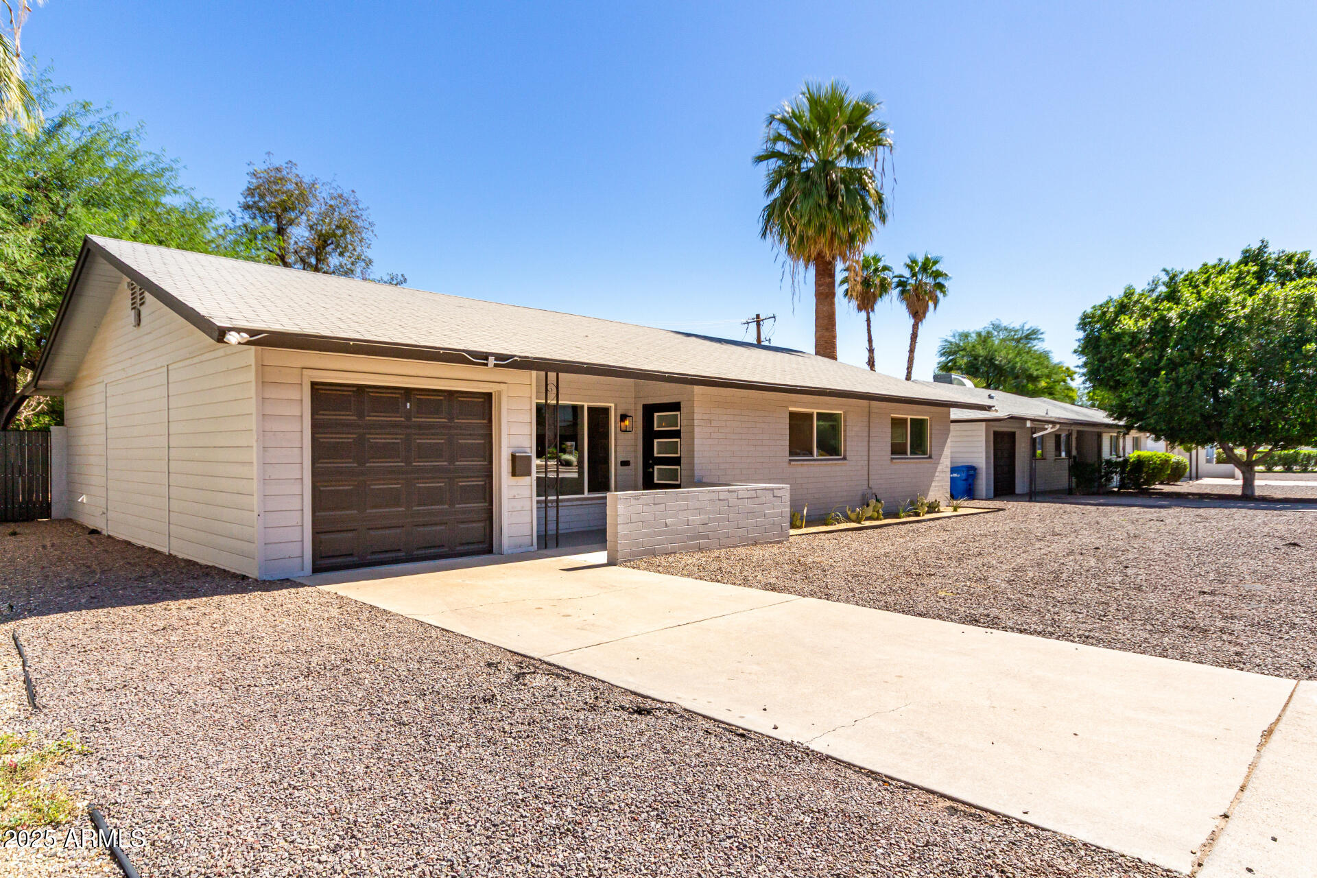 4735 North 24th Street Phoenix, AZ 85016 - Photo 4 of 44 a front view of a house with a yard and garage