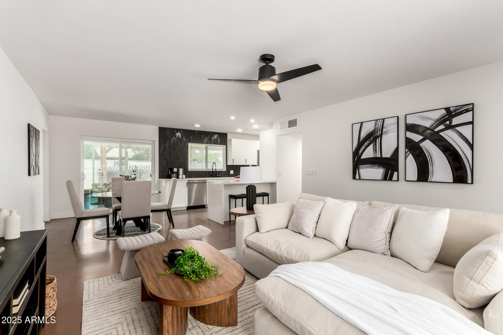 4735 North 24th Street Phoenix, AZ 85016 - Photo 9 of 44 a living room with furniture kitchen view and a window