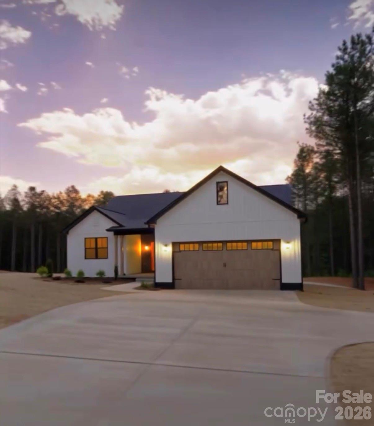 7501 Church Road Taylorsville, NC 28681 - Photo 1 of 17 a front view of a house with a yard and garage