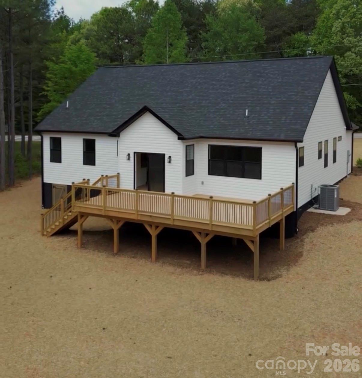 7501 Church Road Taylorsville, NC 28681 - Photo 2 of 17 a backyard of a house with barbeque oven and outdoor seating