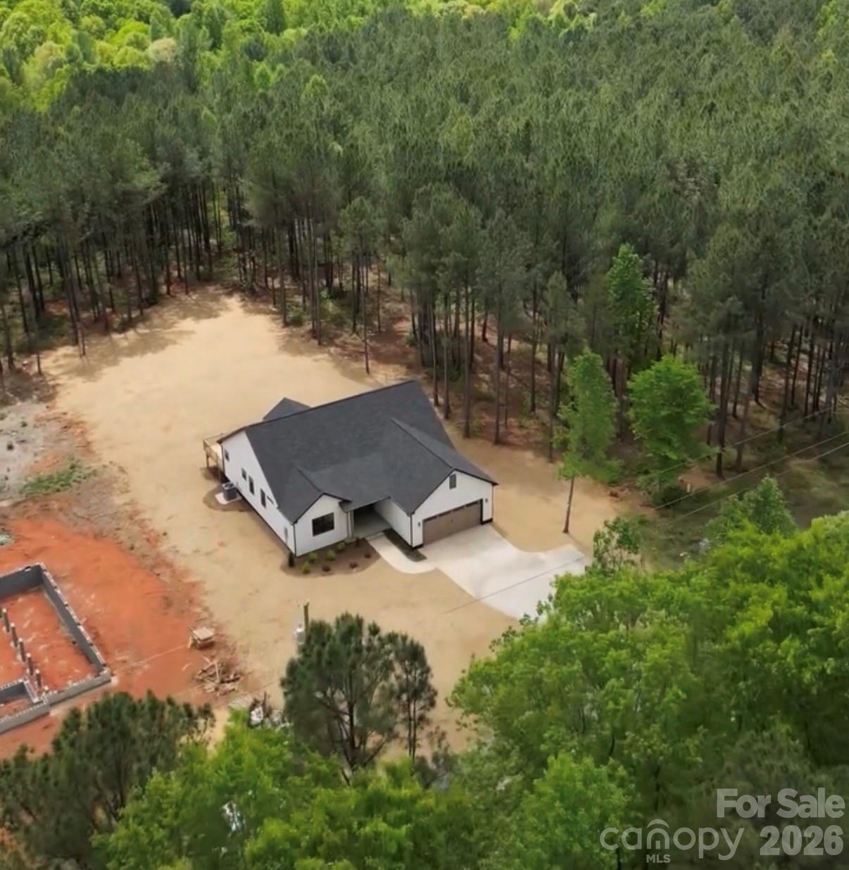 7501 Church Road Taylorsville, NC 28681 - Photo 3 of 17 an aerial view of a house with yard basket ball court and outdoor seating