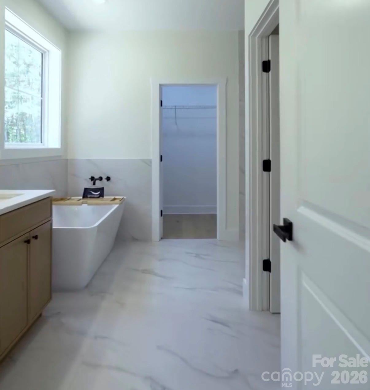 7501 Church Road Taylorsville, NC 28681 - Photo 5 of 17 a bathroom with a bathtub sink toilet and window
