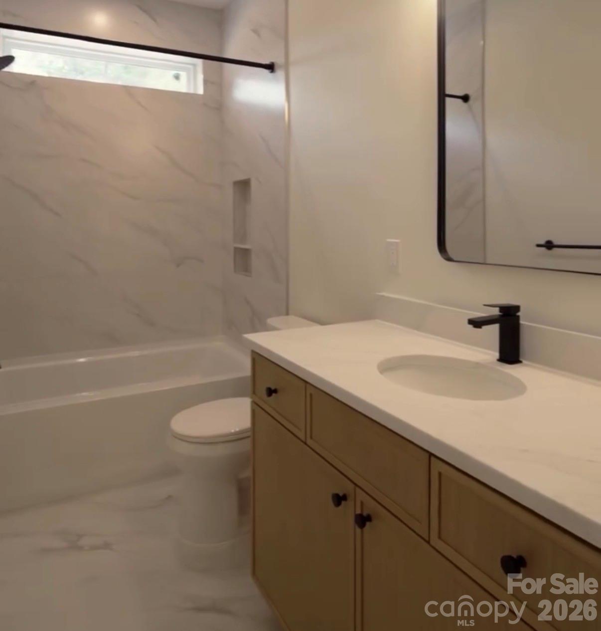 7501 Church Road Taylorsville, NC 28681 - Photo 6 of 17 a bathroom with a sink a toilet and shower