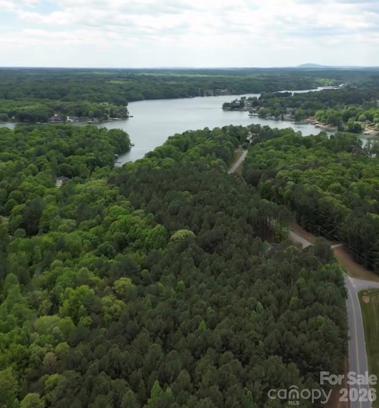 7501 Church Road Taylorsville, NC 28681 - Photo 8 of 17 a view of a lake with houses in the back
