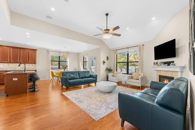 a living room with fireplace furniture and a flat screen tv