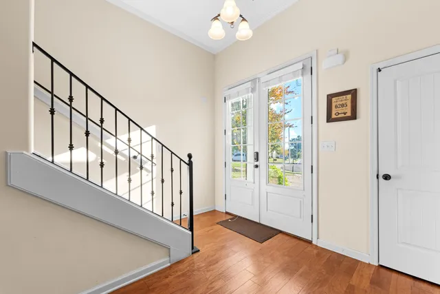 a view of an entryway with wooden floor