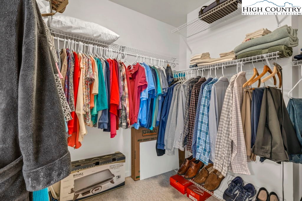438 Virgil's Lane Boone, NC 28607 - Photo 24 of 32 a view of walk in closet with clothes and shoes