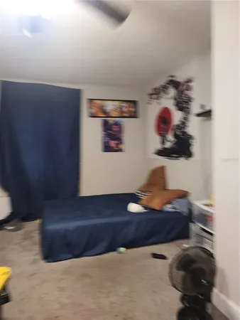 a living room with furniture and a lamp