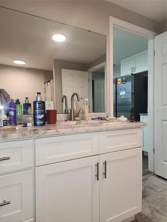 a bathroom with a sink and a mirror