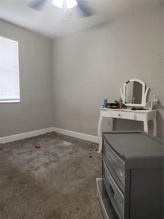 a room with a sink and cabinets