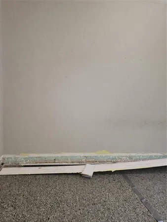 an empty room with a bench