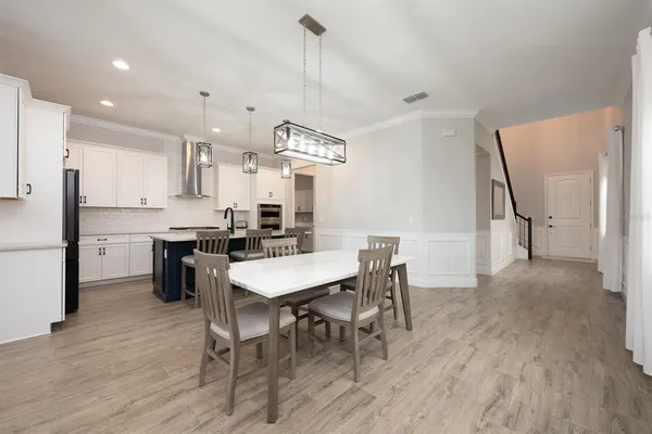 a bathroom with a glass shower door and a sink
