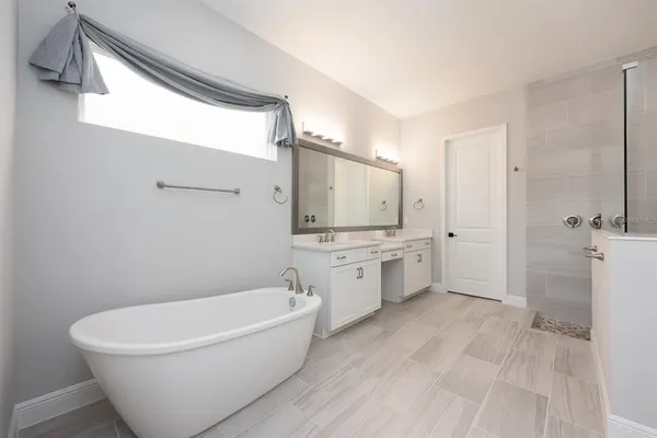 a bedroom with furniture and a ceiling fan