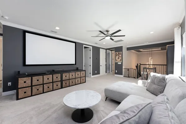 a bed room with a bed and a ceiling fan