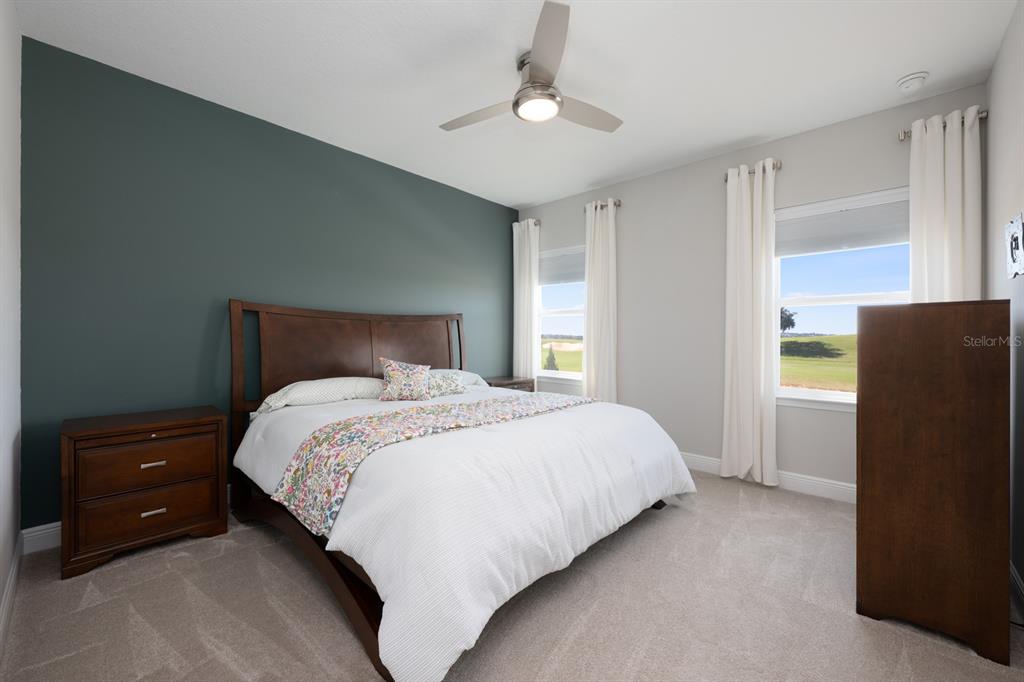 15714 Vetta Drive Montverde, FL 34756 - Photo 21 of 45 a bedroom with a bed and a closet