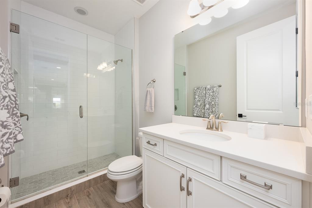 15714 Vetta Drive Montverde, FL 34756 - Photo 25 of 45 a bathroom with a sink a toilet and shower