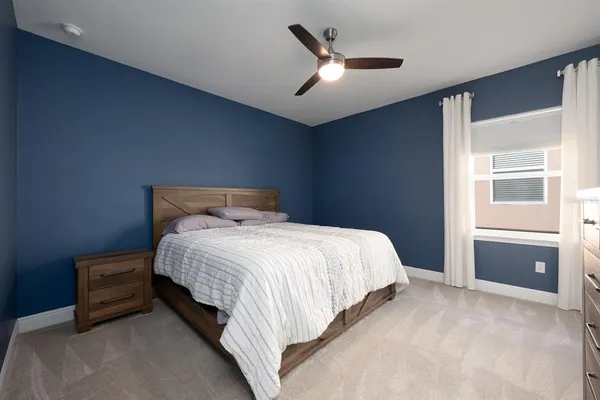 a swimming pool with outdoor seating and yard