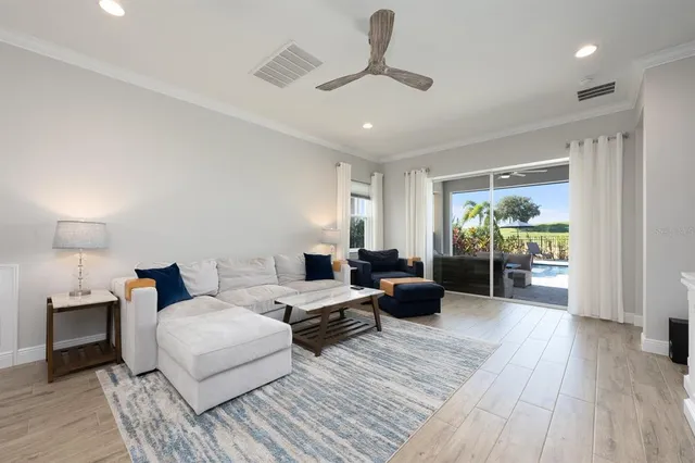 a large kitchen with a table and chairs