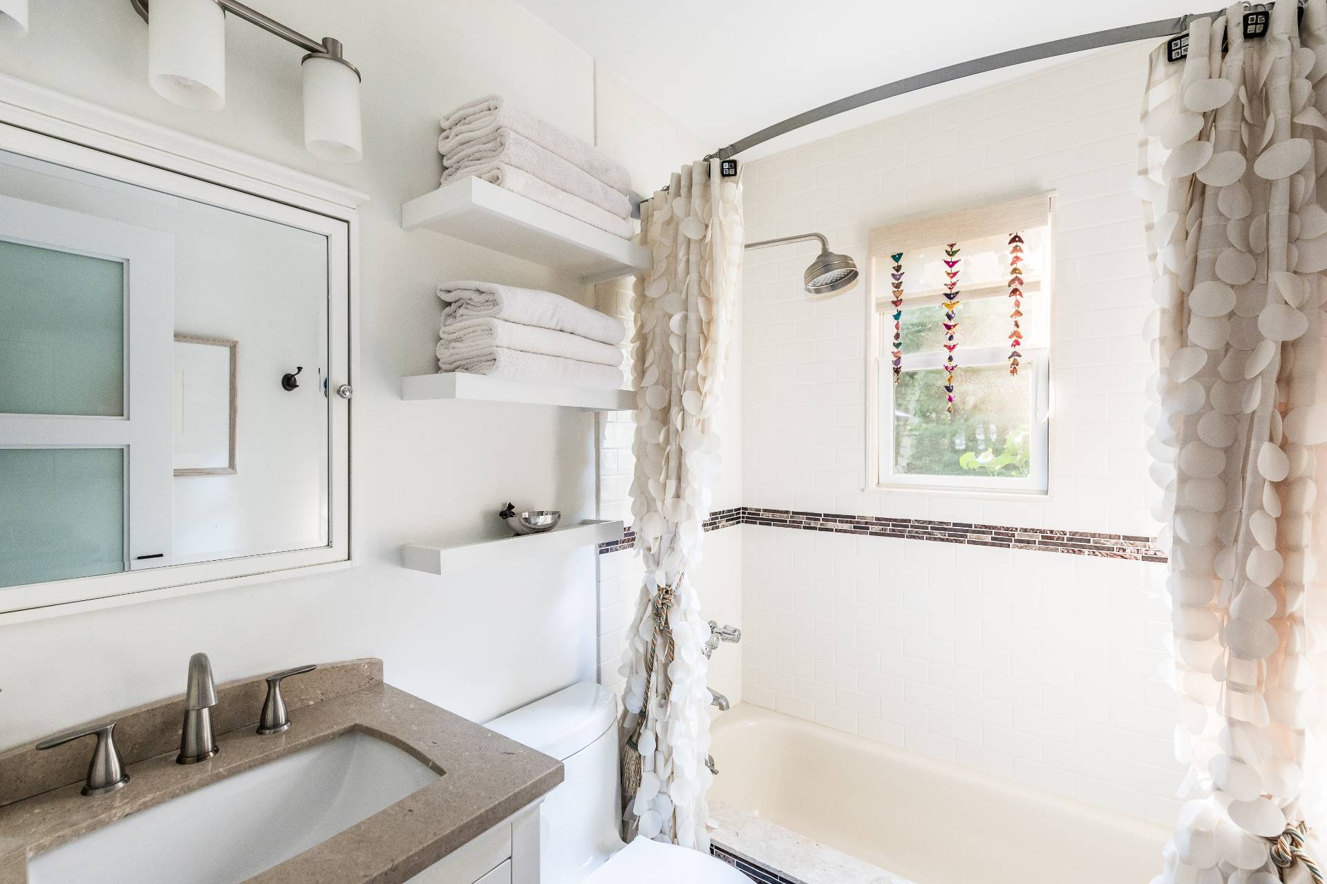 102 Rutland Road East Hampton, NY 11937 - Photo 11 of 20 a bathroom with a sink mirror toilet and bathtub