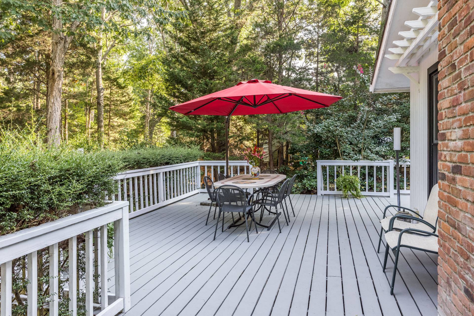 102 Rutland Road East Hampton, NY 11937 - Photo 14 of 20 a view of balcony with wooden floor and outdoor seating