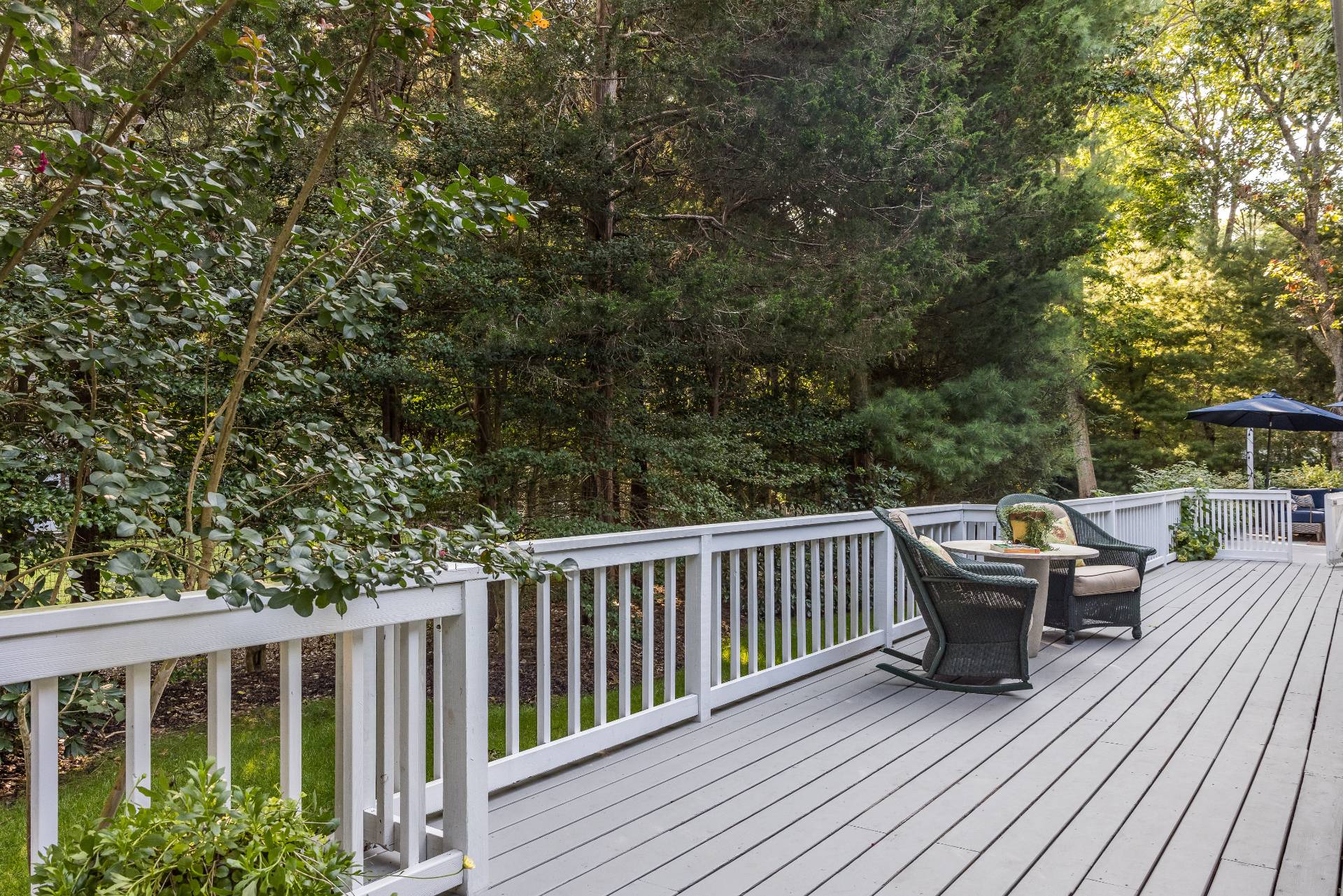 102 Rutland Road East Hampton, NY 11937 - Photo 17 of 20 a view of roof deck with lawn chairs and wooden fence