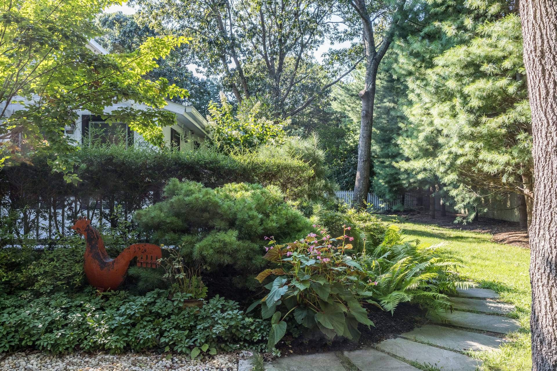 102 Rutland Road East Hampton, NY 11937 - Photo 19 of 20 a view of a garden with a fountain