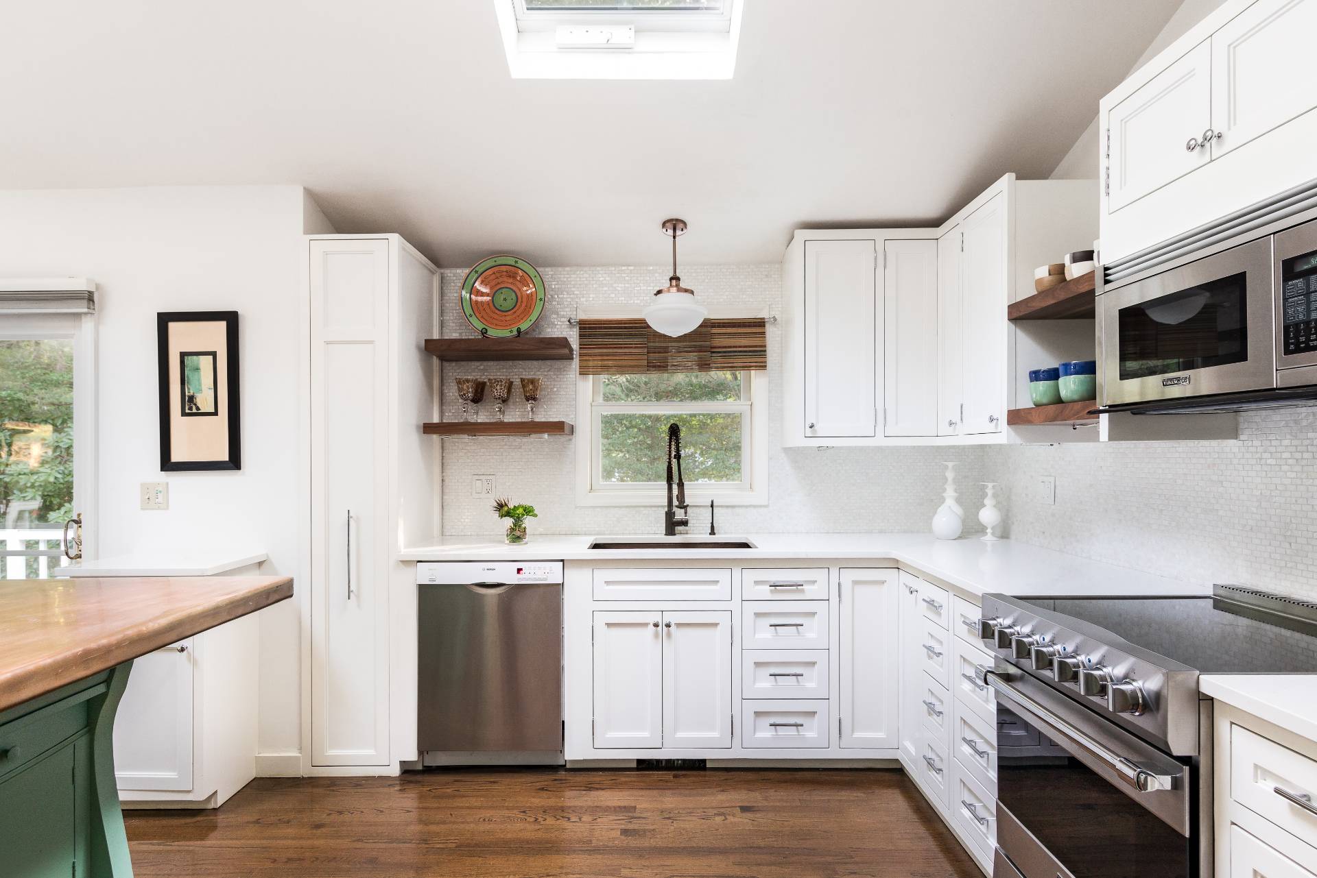 102 Rutland Road East Hampton, NY 11937 - Photo 6 of 20 a kitchen with stainless steel appliances white cabinets and a stove top oven
