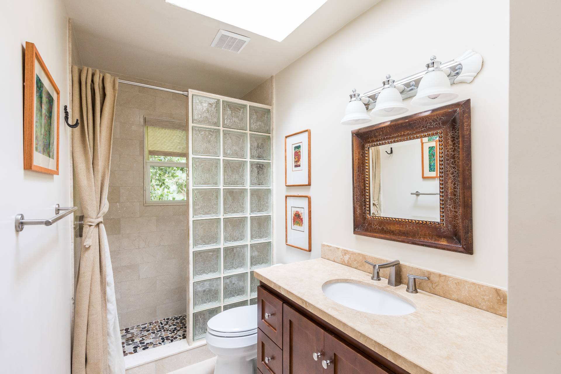 102 Rutland Road East Hampton, NY 11937 - Photo 9 of 20 a bathroom with a sink a toilet and shower