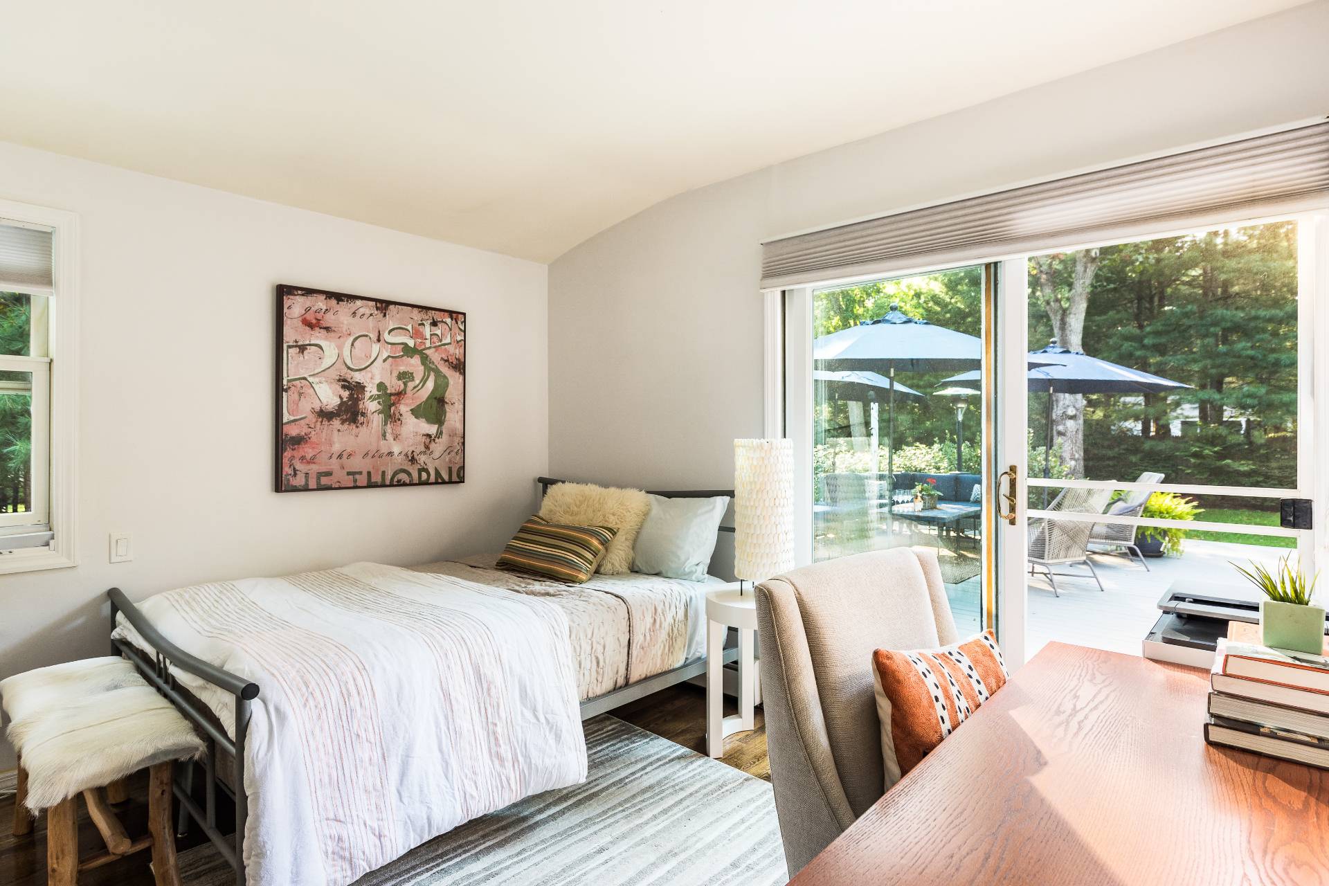 102 Rutland Road East Hampton, NY 11937 - Photo 10 of 20 a bedroom with a large bed and a large window