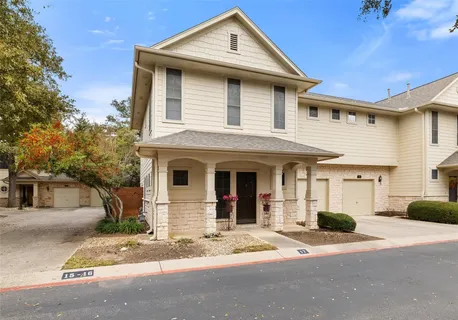 a front view of a house with a garage