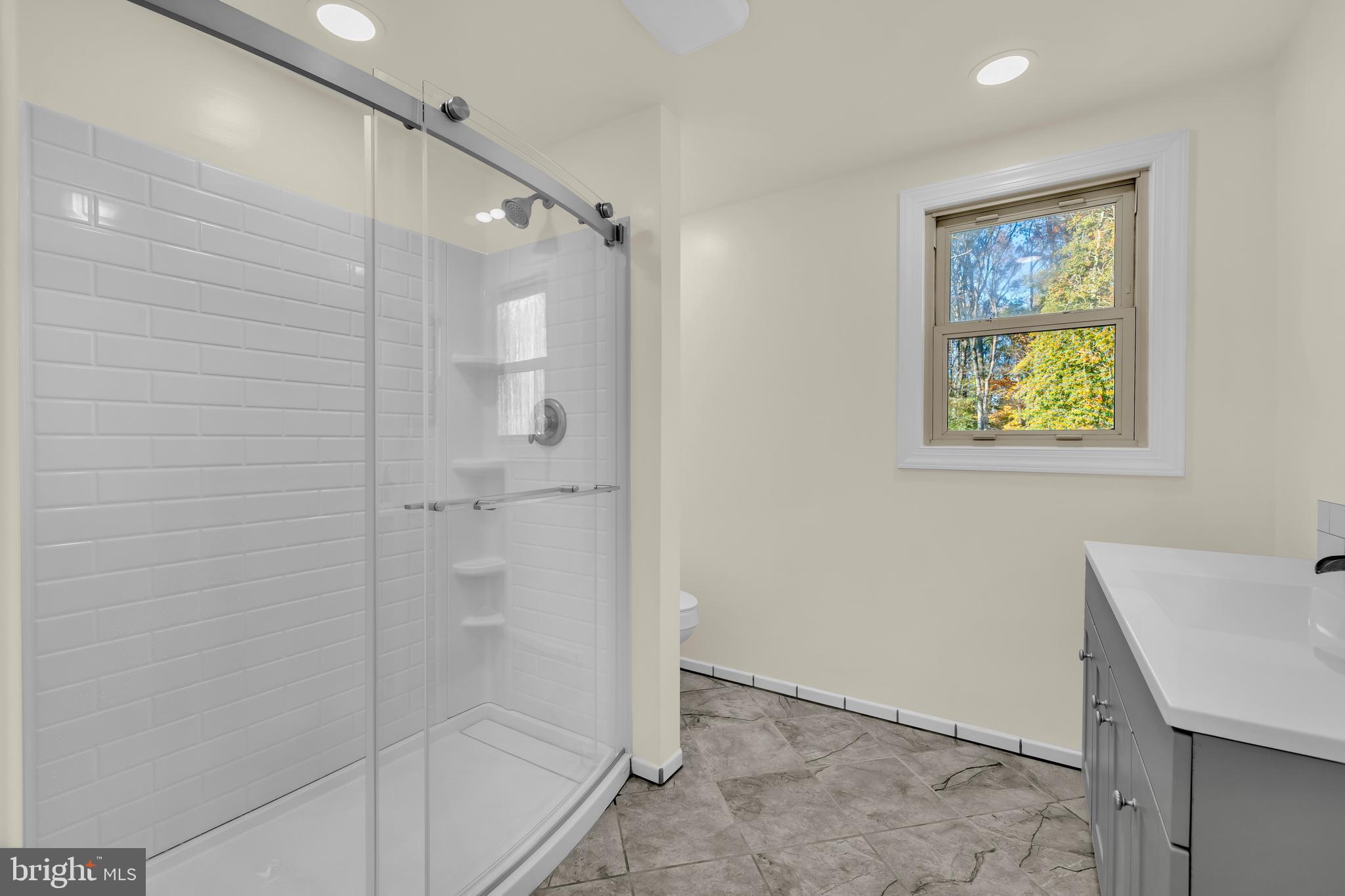 334 Deep Shore Road Denton, MD 21629 - Photo 14 of 48 a bathroom with a shower and a sink