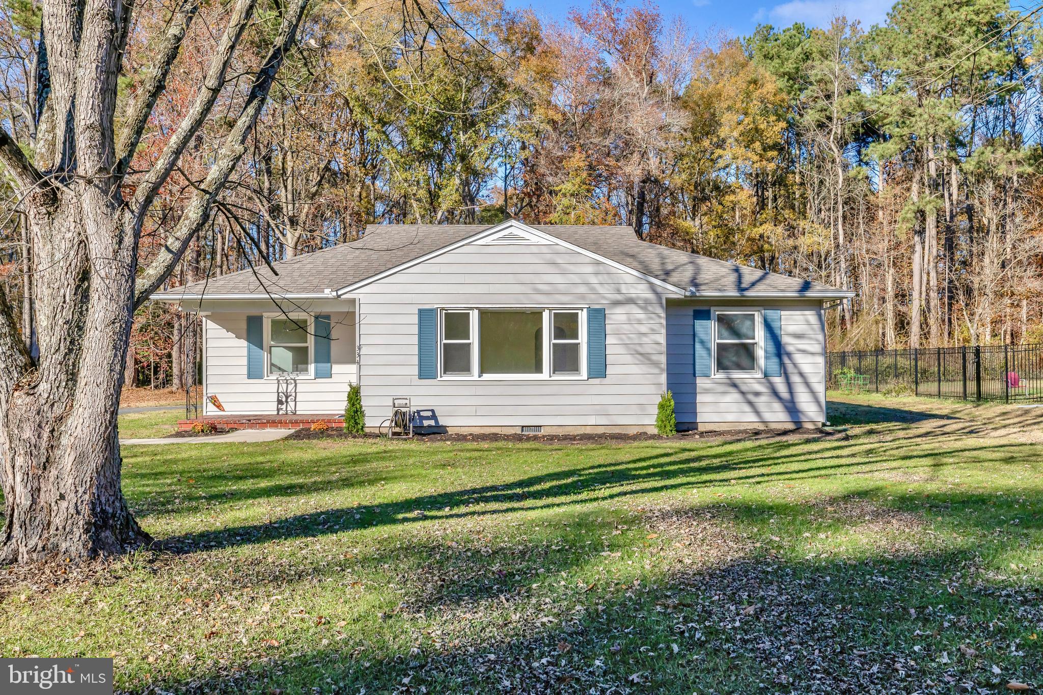 334 Deep Shore Road Denton, MD 21629 - Photo 2 of 48 a front view of a house with a garden