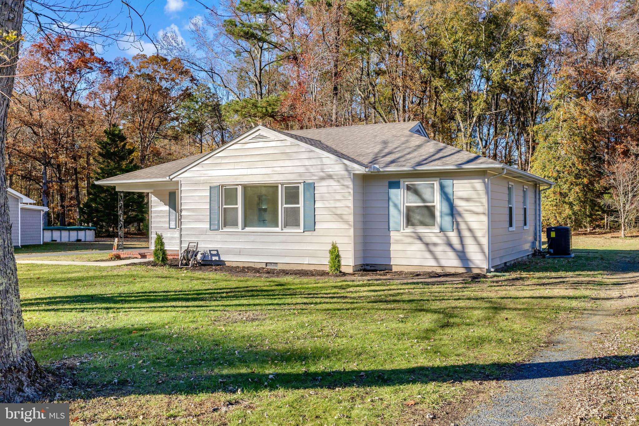 334 Deep Shore Road Denton, MD 21629 - Photo 4 of 48 a front view of a house with a garden