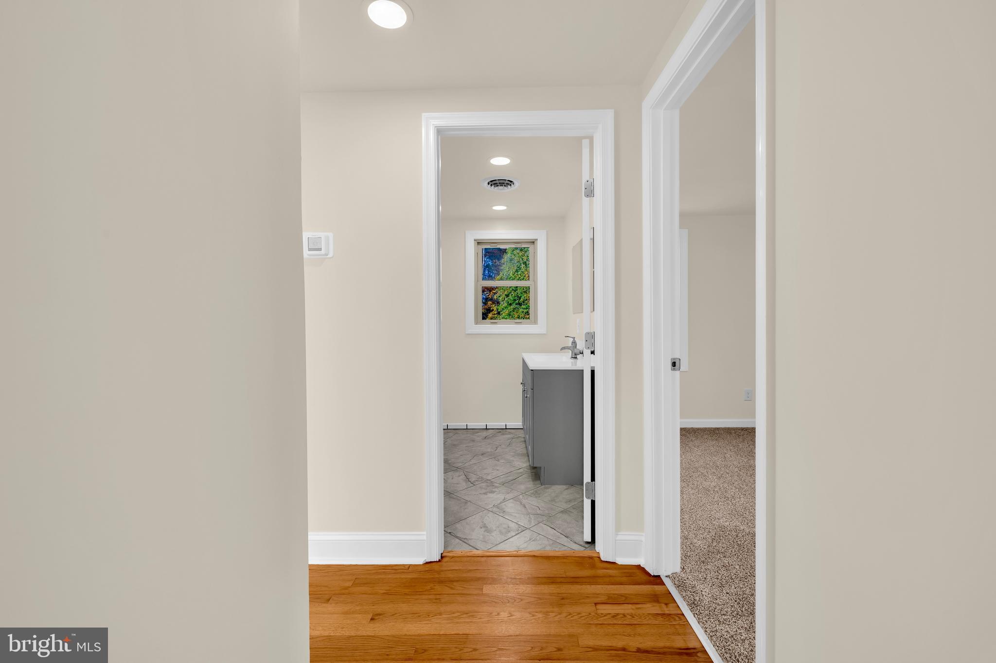 334 Deep Shore Road Denton, MD 21629 - Photo 42 of 48 a view of a hallway with wooden floor and a bathroom