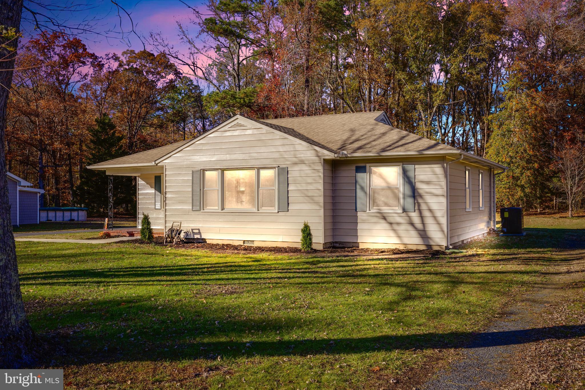 334 Deep Shore Road Denton, MD 21629 - Photo 8 of 48 a front view of a house with a yard