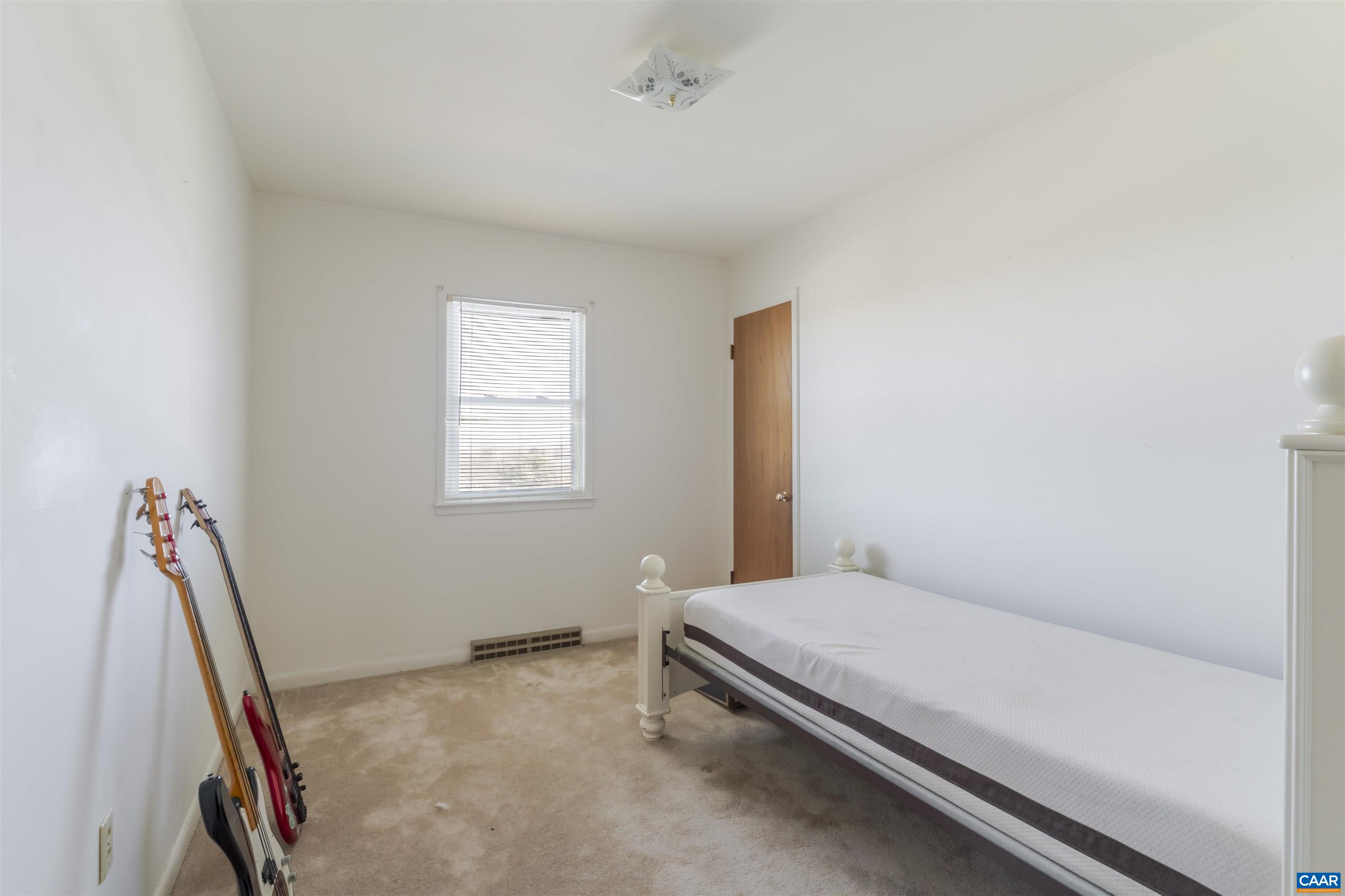906 Alta Street Staunton, VA 24401 - Photo 18 of 34 a bedroom with a bed and a window