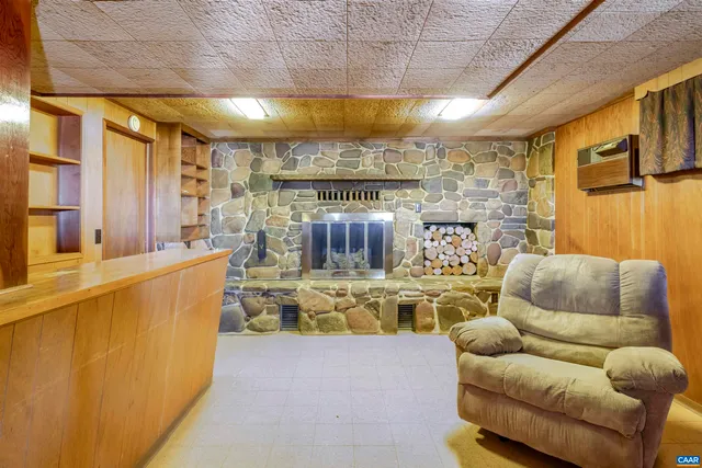 a balcony with furniture and a large window