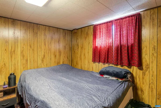 a bedroom with a bed and a closet