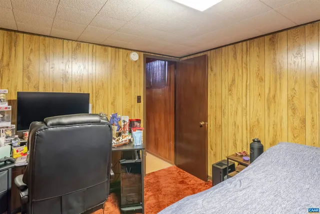 a view of a livingroom with furniture and a window