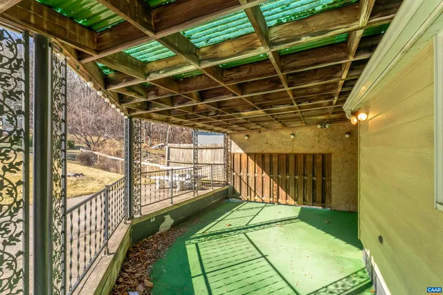 a view of an empty room with a balcony