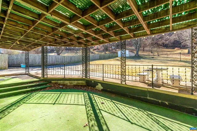 a view of swimming pool with a patio