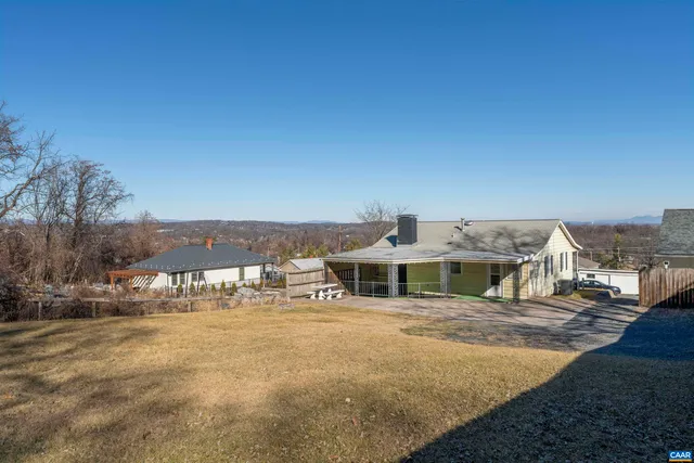 a view of multiple houses with a yard