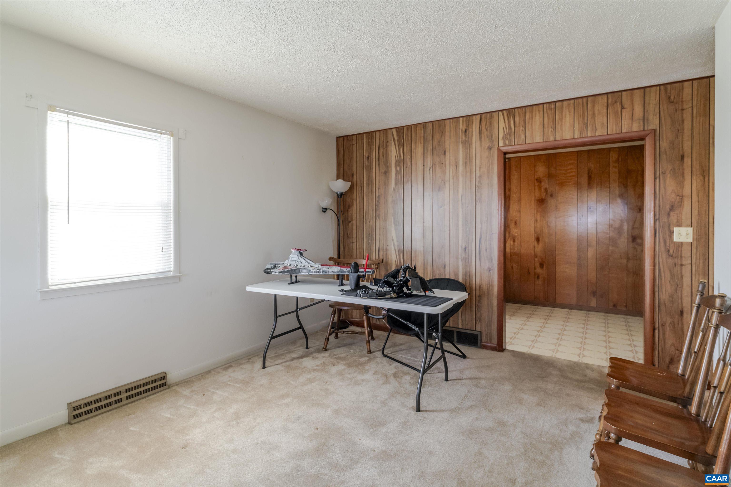 906 Alta Street Staunton, VA 24401 - Photo 6 of 34 a view of a workspace with furniture and a window
