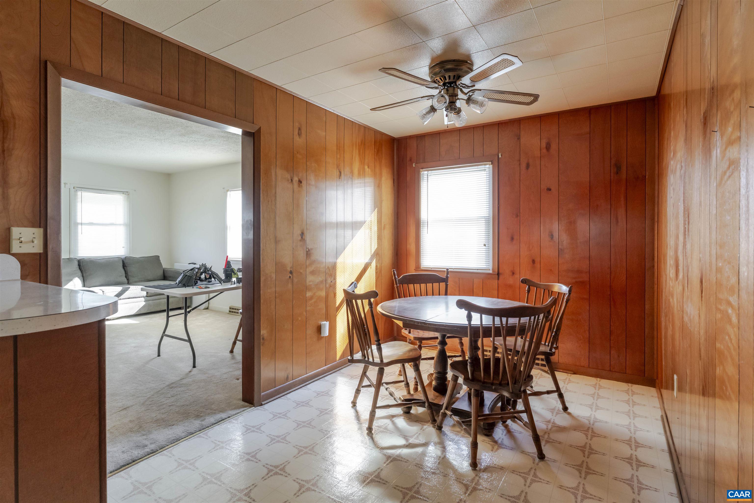 906 Alta Street Staunton, VA 24401 - Photo 7 of 34 a view of a dining room with furniture and a chandelier fan