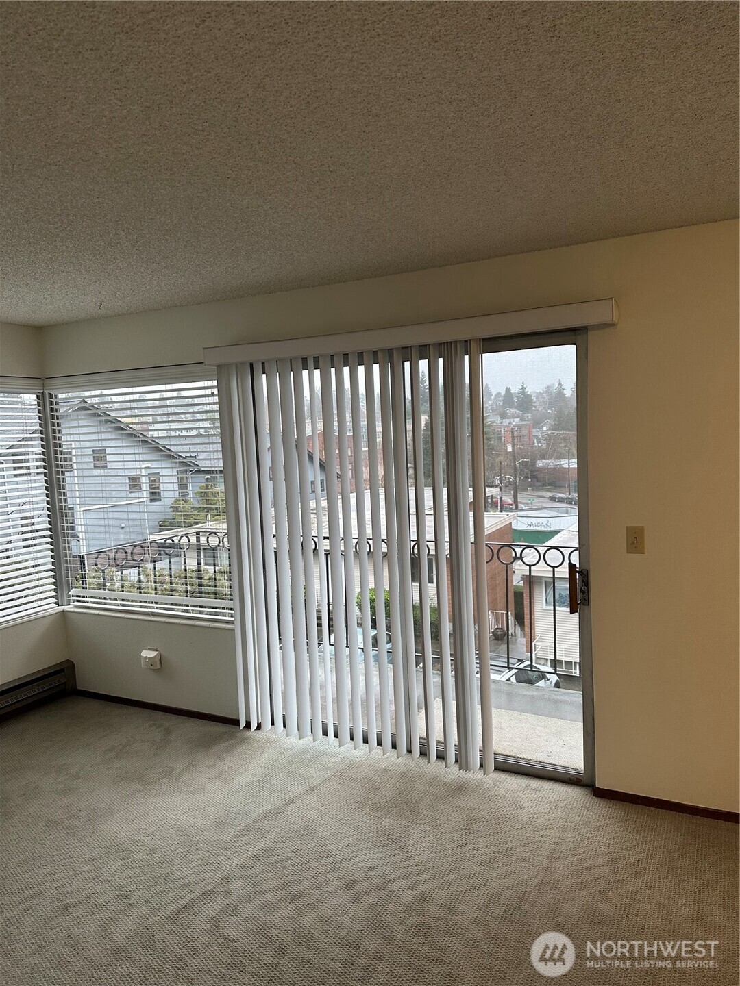 3828 Whitman Avenue North Seattle, WA 98103 - Photo 5 of 8 a view of an empty room with a balcony