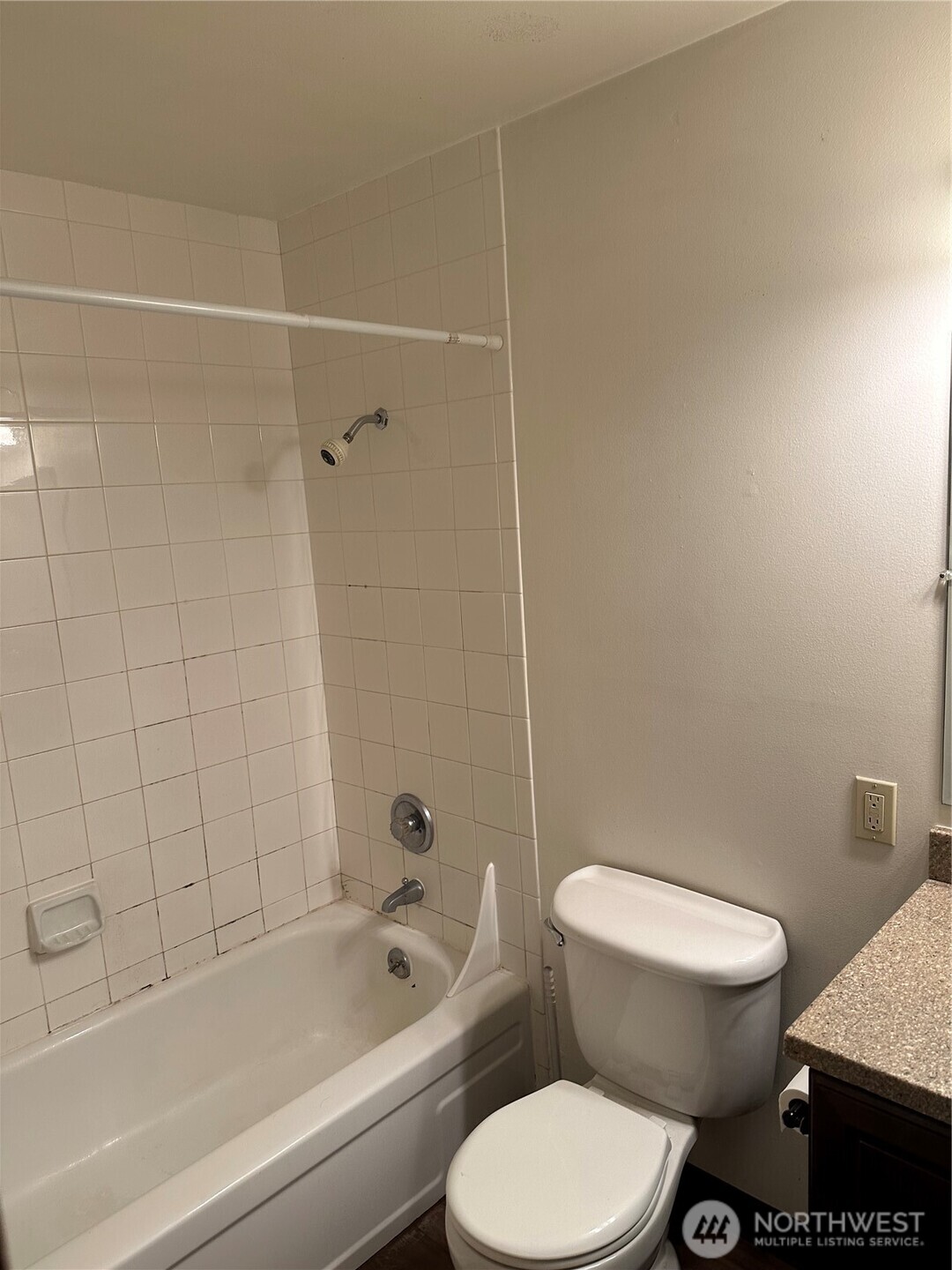 3828 Whitman Avenue North Seattle, WA 98103 - Photo 8 of 8 a white toilet and tub sitting next to a bathroom sink