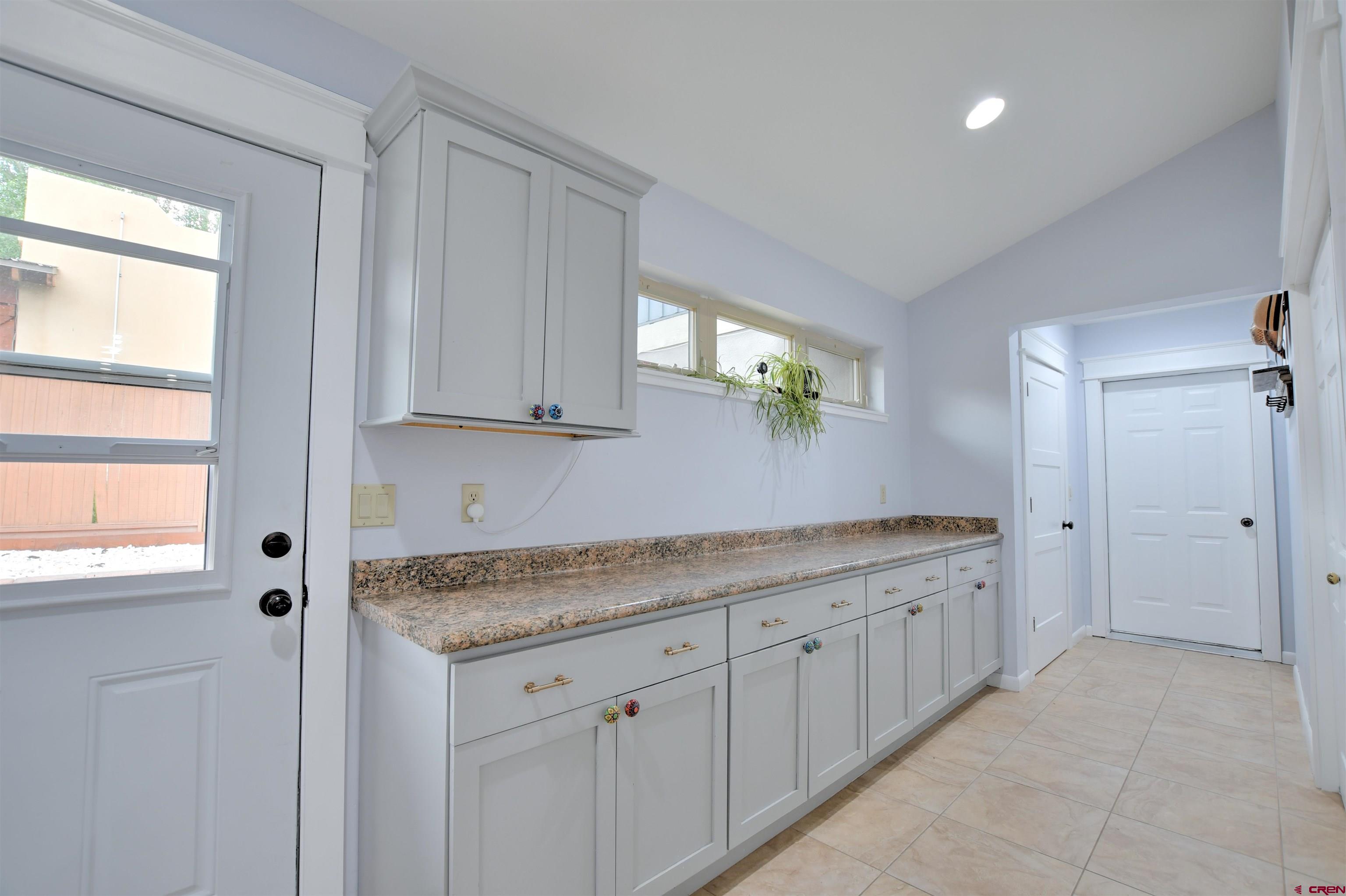 602 Chipeta Drive Ridgway, CO 81432 - Photo 29 of 41 a bathroom with a granite countertop sink and a mirror